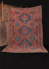 early 20th century caucasian soumak rug with lesghi star design in blue on pink field in great condition
