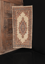 Kerman rug with ivory ground with central medallion and cornices with a curvilinear floral design. in excellent condition