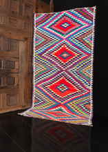 Kowli rag kilim handwoven during 21st century in Northwest Iran. Four large diamonds striped in a multitude of bright vibrating colors. 