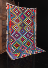 Contemporary Persian kilim in bright colors arranged in a small diamond pattern