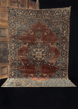 Antique Yazd rug handwoven in Central Iran during first quarter of 20th century. Floral central medallion on a deep maroon field. Ivory details lighten the floral design. 