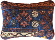 Pillow crafted from fragments of handwoven antique Kurdish rug 