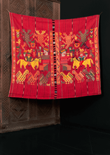 Textile crafted on a backstrap loom near Nahuala, Guatemala during 20th century. Called a tzute meaning a multifunctional cloth used to wrap or carry things on a person's head. Interesting design of shapes, animals and figures. 