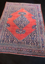 Bidjar rug handwoven second quarter of 20th century in Western Iran. Open red field, soft brash, central medallion with a Herati design on an indigo field. 