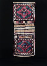 Veramin double saddlebag or "Khorjin" woven during third quarter of 20th century in Iran. Stylized boteh surrounded by four serrated leaves. Blues, greens and purple. 