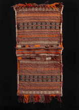 Kilim woven double saddlebag or "Khorjin" woven in Afghanistan during second quarter of 20th century. Closure is composed of brown, purple and orange slit tapestry. Bag face design is multicolored stripes in brown and purple with geometric patterns within. 