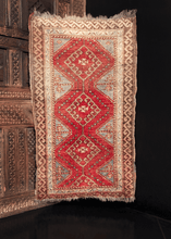 Yastik handwoven during second quarter of 20th century in Turkey. Three hooked diamonds form central design in bold red and a soft blue. 