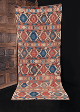 Colorful Shirvan kilim handwoven end of 19th century in Eastern Caucasus. Striped pattern of bold geometric shapes in blues, peaches, reds and tans. 