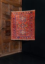 small karadja rug from the early 20th century featuring a three medallion design in reds, blues, and browns. Excellent condition