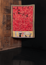compass rose hook rug from the early 20th century with a depiction of a pilgrim woman spinning wool