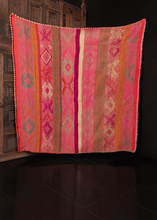 Contemporary Guatemalan blanket in multicolor stripes with geometric design on top, with crocheted edges in scalloped pattern