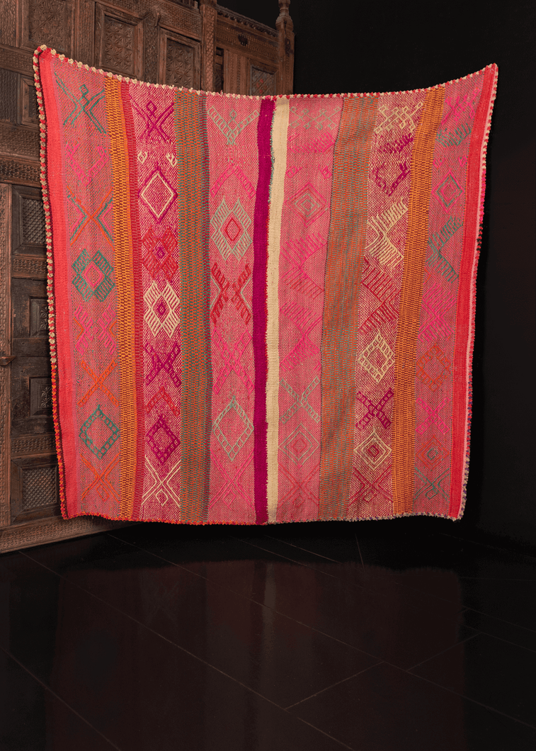 Contemporary Guatemalan blanket in multicolor stripes with geometric design on top, with crocheted edges in scalloped pattern