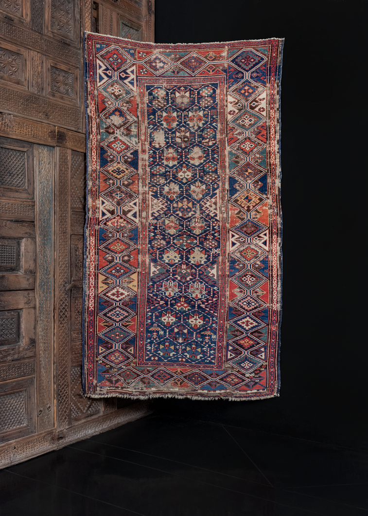 Antique shirvan rug with lattice design and geometric blossoms. Worn but in solid condition