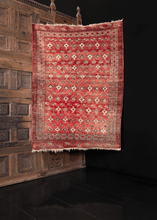 traditional turkmen rug in soft reds browns and ivories with abrash throughout