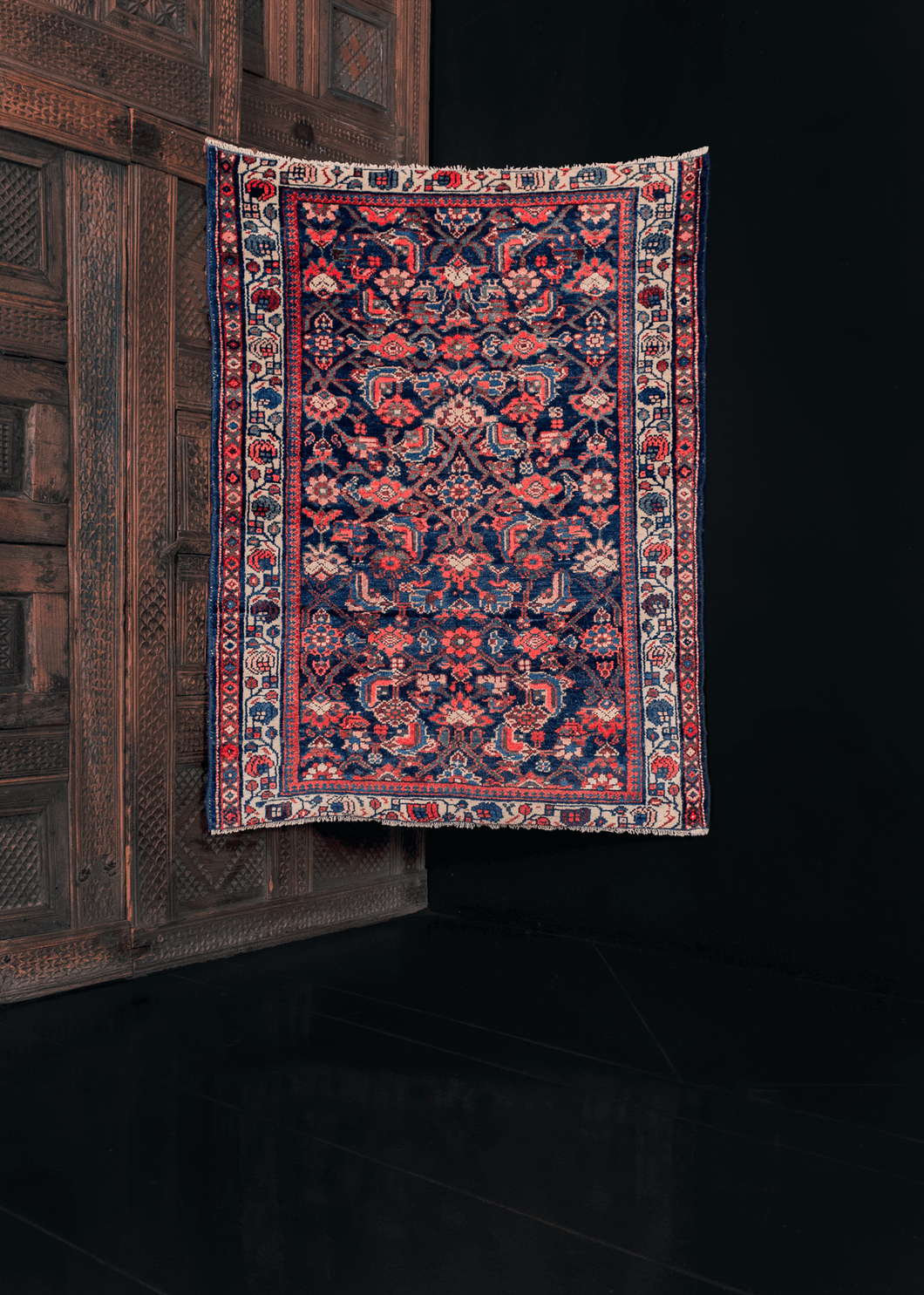Hamadan rug with a deep blue indigo field and traditional leaf and blossom design, in bright red and soft ivory