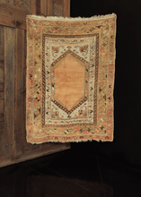 Turkish rug with plain central medallion and multiple borders in peach and gold tones