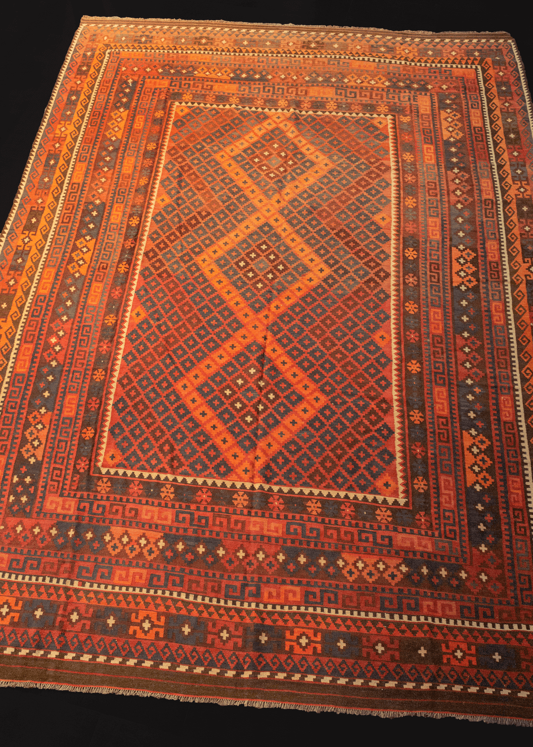 mid century maimana kilim with concentric diamond design in blue, red, and brown color palette