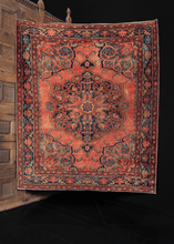 early 20th century lilihan rug from w iran with large central and cornices, with elaborate and unusual borders in peaches, indigo blues, and reds