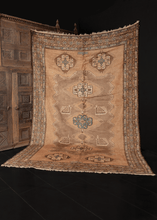 Mid century Caucasian Karabagh rug with a large scale geometric design in golds, browns and blues, with soft silky pile and lustrous sheen