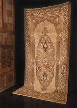 Khoy rug handwoven during middle of the 20th century in Northwest Iran. Undyed wool field with central medallion. Multiple shades of brown achieved by carding the wool. 