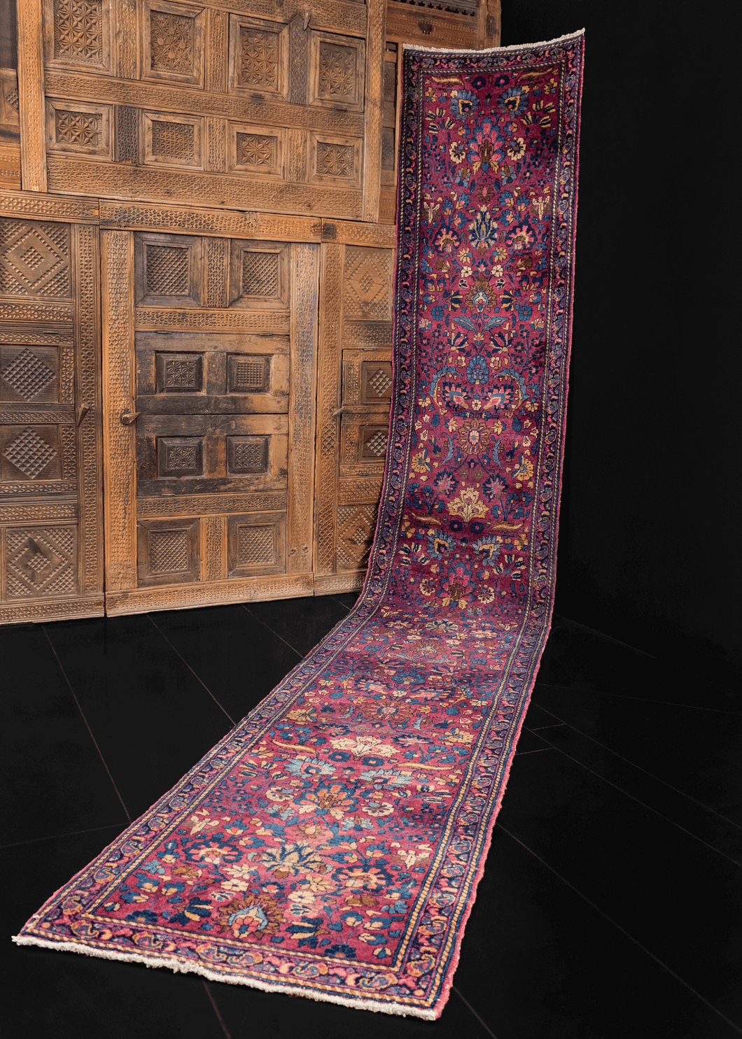 Mashad runner with complex curvilinear floral design on deep purple field 