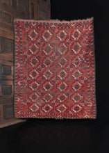 Mid Century Central Asian Ersari Turkmen Rug with repeating gun patterning on a red field