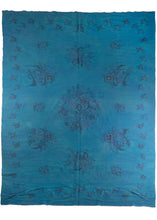 Mid century Romanian kilim overdye featuring a bright blue field. Remnants of the original design of floral bouquets are still visible through the deep dye. 