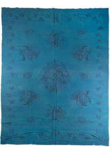 Mid century Romanian kilim overdye featuring a bright blue field. Remnants of the original design of floral bouquets are still visible through the deep dye. 