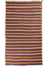 Mid century Afghani Jajim featuring multiple strips sewn together horizontally with a pattern of alternating stripes in yellow, navy, crimson and a bright white attained by using cotton. The stripes are rendered with both stepped and serrated edges.  Very versatile textile, can work as a rug, wall hanging, or throw. Initially intended for use in a tent as a divider, to cover belongings, as a sofreh or potentially all of these and more. 