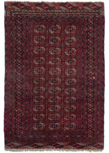 This Midcentury Tekke Turkmen Rug features a repeat design of the classic Tekke guls on a rich red ground. Finely woven for type with over thirty guls are tightly packed into three columns. Well contrasted secondary tones of navy, orange, white, yellow, and magenta breathe life into the rug. Fine weaving and contrast are used to great effect adding dimensionality to details like the bent ribbon minor borders.