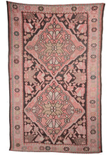 Mid cenntury Karabagh kilim featuring two diamond medallions on a dark brown field. The diamond medallions are composed of geometric floral designs, which continue throughout the larger composition. The color palette is soft and minimal with browns, reds as the main colors, white and soft blues adding details and interest. 