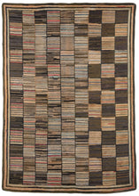 Mid century north American hooked area rug featuring a checkerboard pattern with each square made up of vertical stripes. Many colors can be found in this piece due to the use of recycled fabric, but it reads as grey and black overall.