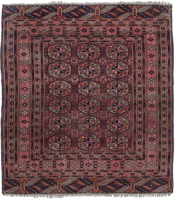 This Midcentury Tekke Turkmen Rug features repeat design of the classic Tekke major and minor guls on an aubergine ground. The plump guls are closely clustered and well balanced with skirts on both ends. Ivory and surmah accents share the composition with once powerful hot pinks and orange which patinated enough to harmonize with the piece yet still contain a fiery glow. 