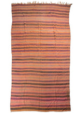Wool Moroccan Blanket that features horizontal bands in a soft color palette of pink,  orange, purple, yellow and brown. Some stripes are framed by weft floats on each side which add a subtle dimensionality.