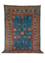 Mid Century NW Chinese Khotan rug with bright blue field 
