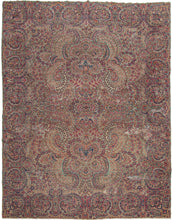This Kerman was handwoven in Central Iran during the second quarter of the 20th century.  It features an elegant allover design of wild "c" scrolls entangled in waves of floral sprays in blues, reds, purple, and gold on a wonderful seafoam green ground. The intricate and perfectly reconciled spiraling border melds right into the controlled chaos of the field. 