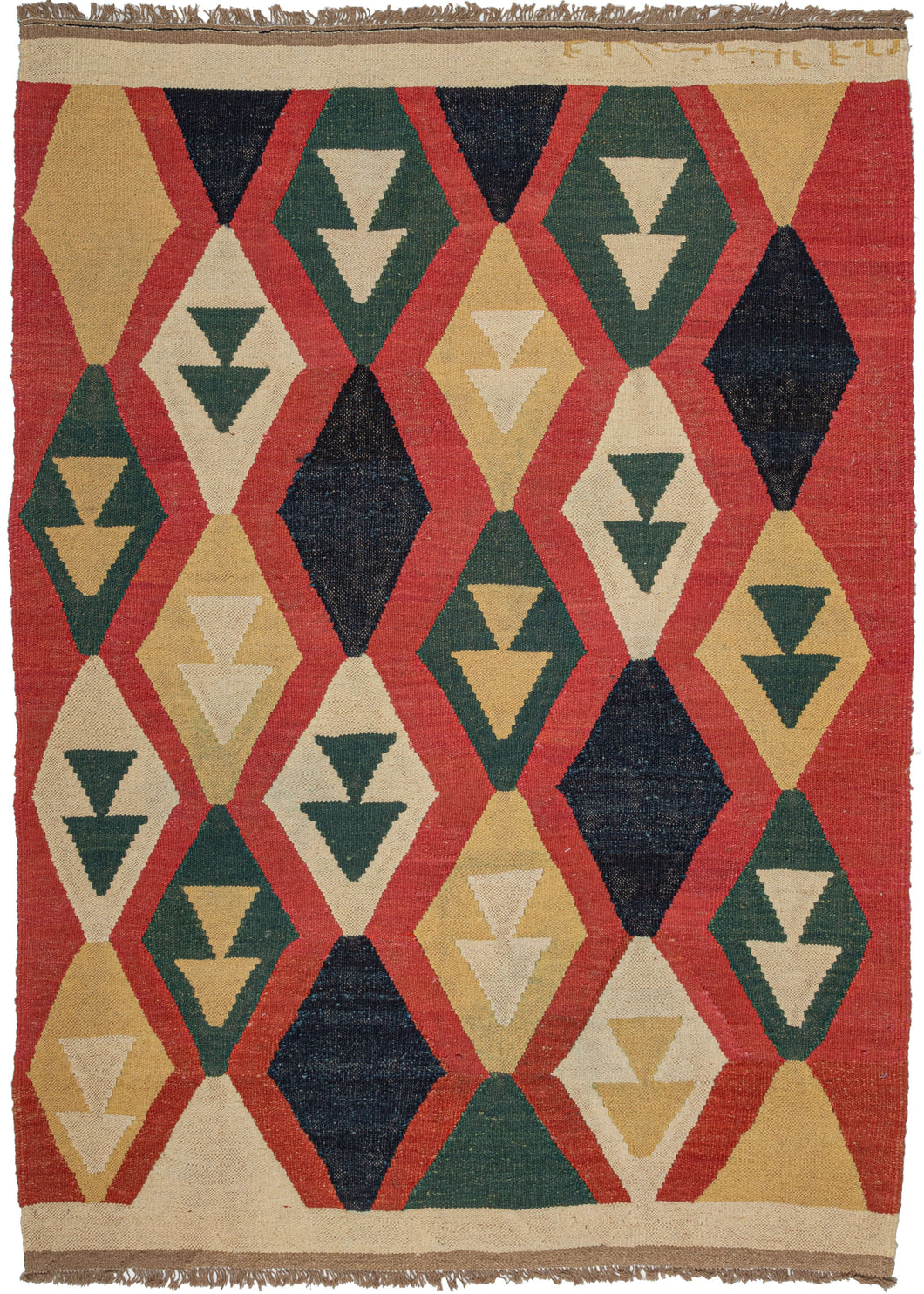 This Contemporary N Persian Kilim features vertical columns of diamonds in yellow, green, ivory, and navy on red ground. The columns are staggered with most but all containing two stacked triangles which may be an abstraction of a vase or vegetal form. It is finished with a block of undyed ivory wool at the top and bottom. 