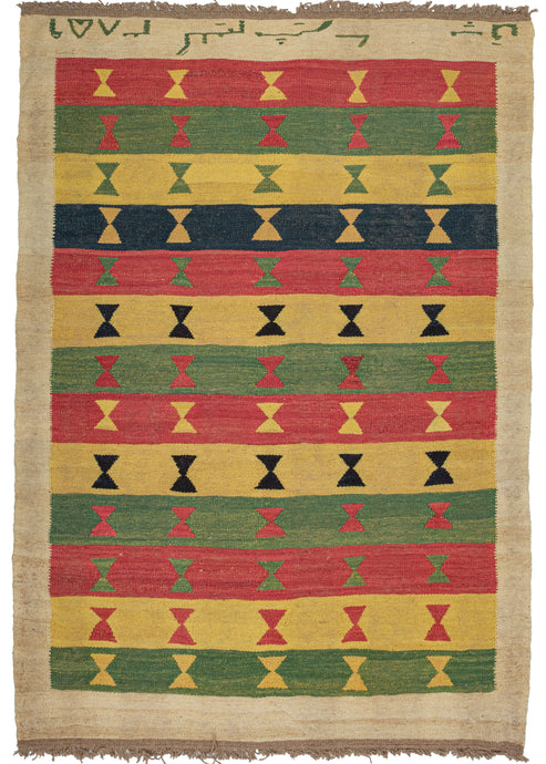 This Contemporary N Persian Kilim features horizontal rows in red, yellow-green, and navy each with five hourglass shapes in contrasting tones. The rows are stacked and the colors are chosen in no particular pattern giving the piece a welcome randomness. It is framed by a solid ivory border with Farsi text scrolling across the top. 