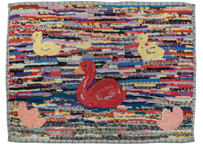 North American hook rug composed of a charming design of a duck and her brood. The large red duck is in the center swimming along with her two small yellow ducklings.