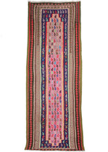 Persian kilim runner Made of recycled fabrics, this rug has an extremely playful and bright color palette. The field is made of a bright pink with small boteh on top in a cacophony of color. Multiple borders surround it in greens, purple, yellows and one comprised of a unique rainbow “static” of mixed color.