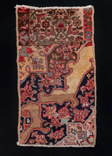 Bidjar wagireh, or rug sample, handwoven in NW Iran during the second quarter of the 20th century. This particular one shows the borders are the top and the repeat unit of the pattern below, showing a floral design for all elements. The colors are in within the typical Bidjar shades of camels, inidigo blues, and madder pinks and reds.   In excellent condition, signs of wear consistent with age. Densely woven with a low pile and sturdy handle. 