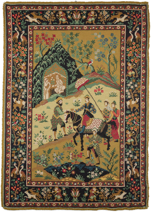 Porteugese needlepoint featuring a scene more commonly associated with the Mughal or Safavid traditions. It appears to be an exchange between a Portuguese noble and his entourage with a bearded man wearing a turban. The border features a variety of hunting scenes.