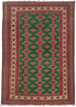 small Bokhara rug featuring a graphic design of lozenges and diamonds on a bright green field. The multiple borders feature classic Turkmen influences in shades of red, ivory, and brown. 