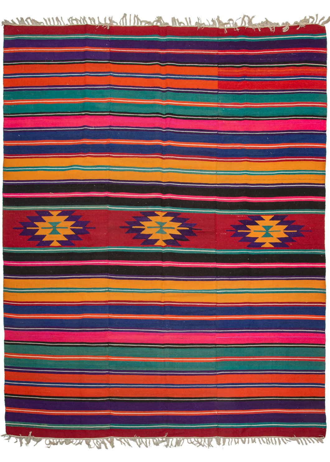 Turkish beach kilim featuring a very bright and cheerful color palette, with a horizontal stripe design and central geometric motifs. In excellent condition, signs of wear consistent with age.