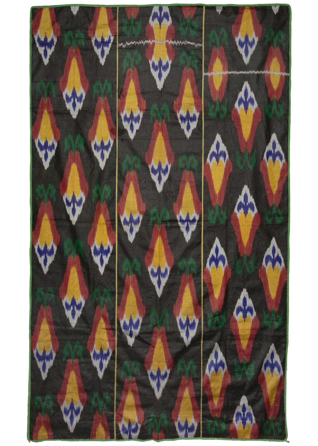 Uzbekistan handwoven silk ikat textile featuring a repeating diamond-like motif in yellow, red, blue, and white atop a black field.