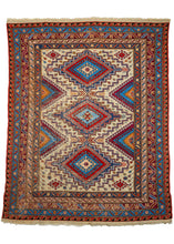 Vintage Caucasian Soumak area rug featuring three latch-hooked concentric diamonds in reds and blues on a bright ivory field. The field is surrounded by multiple distinct borders including greek keys, scrolling 'S's, and most prominently a well-executed calyx and serrated leaf border. 