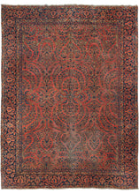 Dynamic Red Sarouk Rug features a curvilinear floral design on a patinated red field. The floral work is intricate and an excellent example of the type of floral sprays Sarouk rugs are known for. The main border features scrolling palmettes on navy ground.