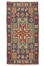 This Antique Swedish Agedyna features a central red eight-pointed star in a green polygon which perfectly connects to two purple blocks on the top and bottom. Throughout the composition, there are various depictions of women and birds. These weavings are called "Agedyna" in Swedish which means "traveling cushion" and they were intended to be used in a carriage primarily but also in the home.