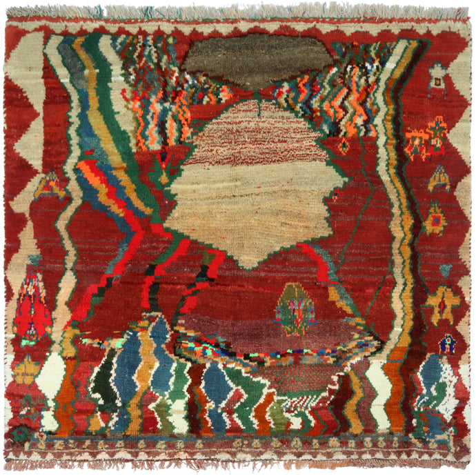This Vintage Abstract Gabbeh Rug features an abstract and graphic geometric design reminiscent of Moroccan weaving. A parade of various colors and forms appears to distort and melt right before the viewer's eyes. The pile is densely woven, making this a plush rug.