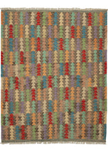 This Contemporary Maimana kilim was woven in Afghanistan during the 21st Century.  It features an all-over field of stacked triangles in a variety of vibrant tones that really pop atop the black and white "static" ground.   In excellent condition, flat-woven with a substantial handle.